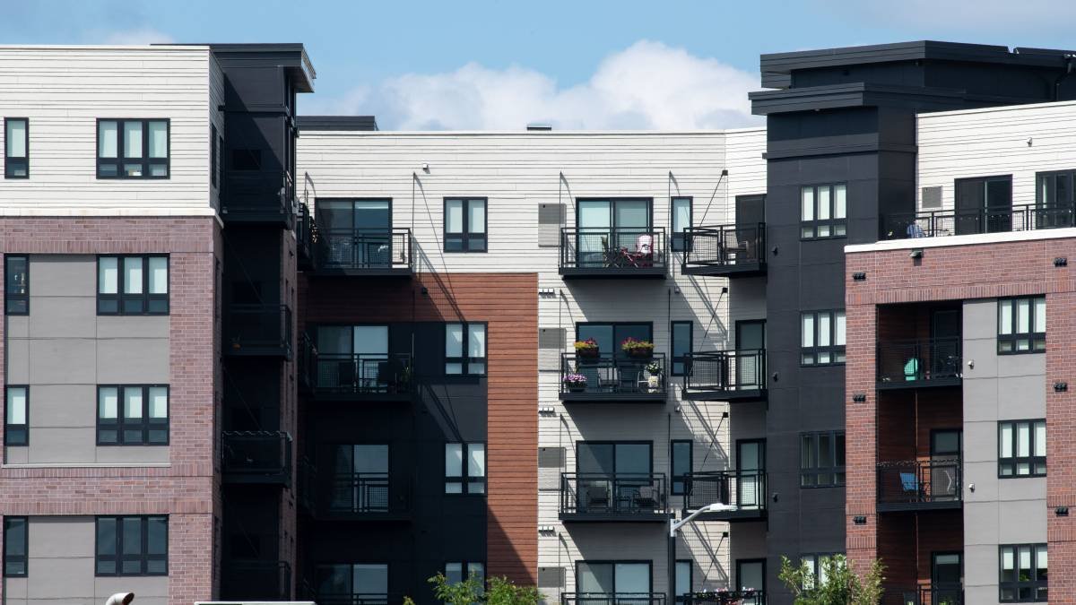 Midrise apartment complex with balconies, apartment insurance
