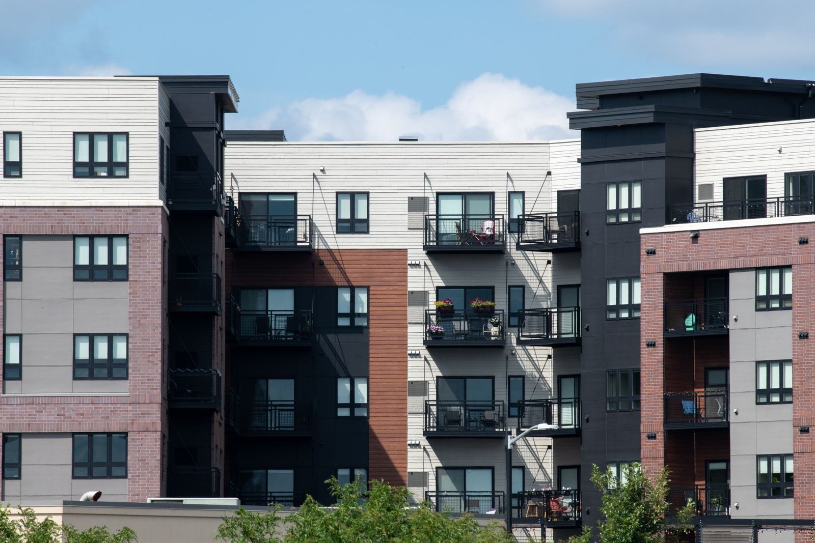 Midrise apartment complex with balconies, apartment insurance