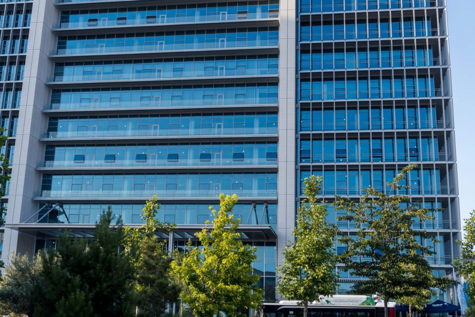 Modern office building with a glass facade, property management insurance